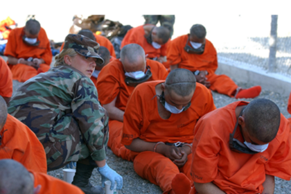Detainees on arrival to Camp X-Ray, the holding facility at Guantánamo Bay, Cuba. © US DoD