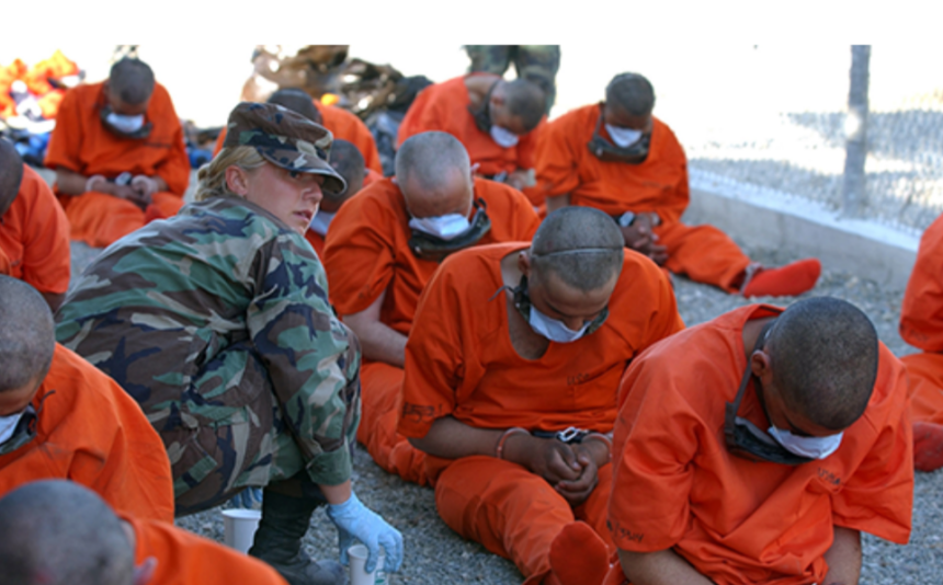 Detainees on arrival to Camp X-Ray, the holding facility at Guantánamo Bay, Cuba. © US DoD