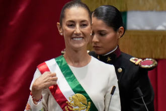 President Claudia Sheinbaum wears the presidential sash during her swearing-in ceremony as Mexico's new president in Mexico City, October 1 2024 Eduardo Verdugo/AP