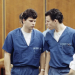 Lyle, left, and Erik Menendez leave the courtroom in Santa Monica, Calif., in August 1990. They were sentenced to life in prison without the possibility of parole in 1996 — and resentenced this week. Nick Ut/AP